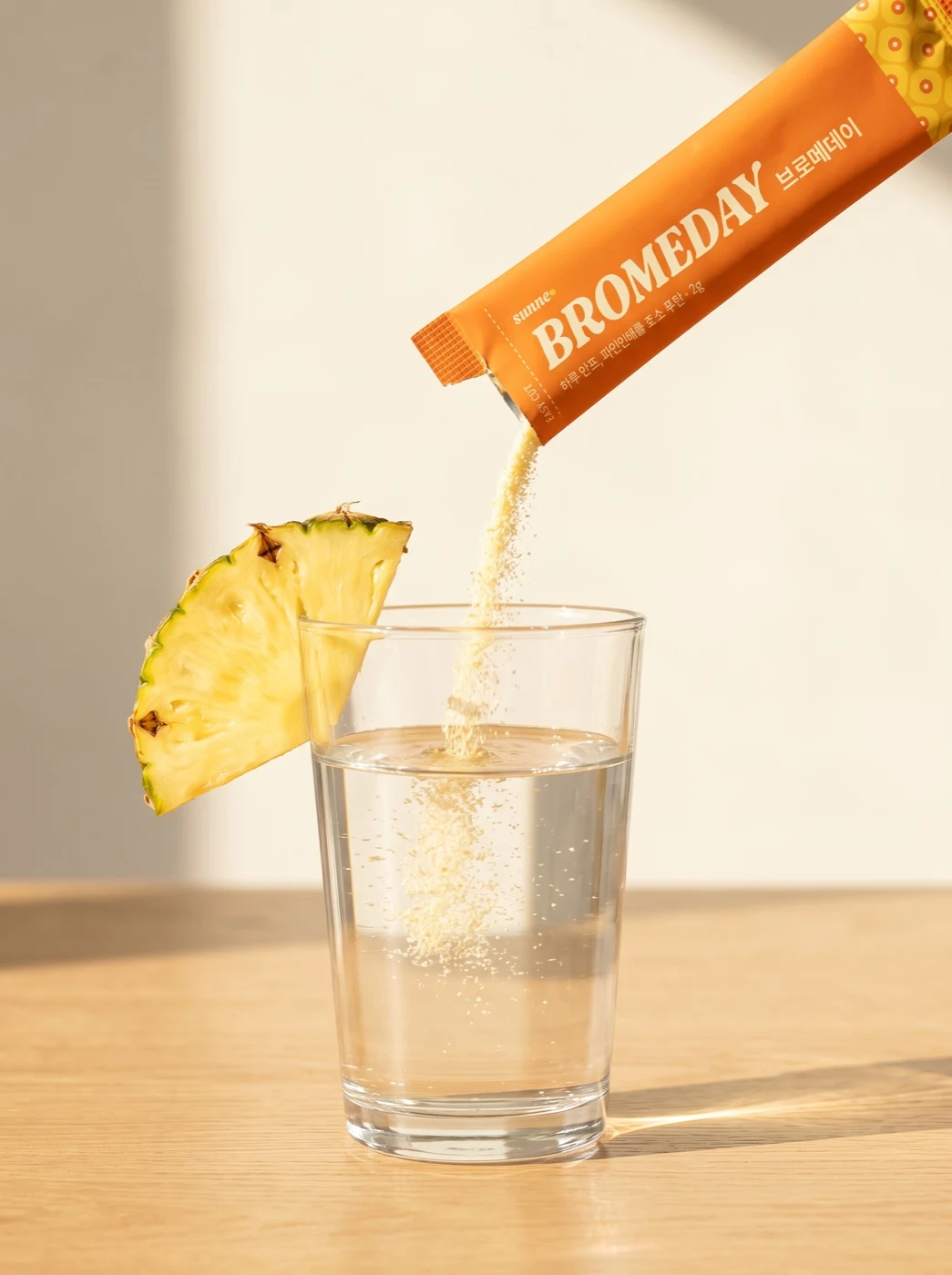 Stick pouring into a glass of water