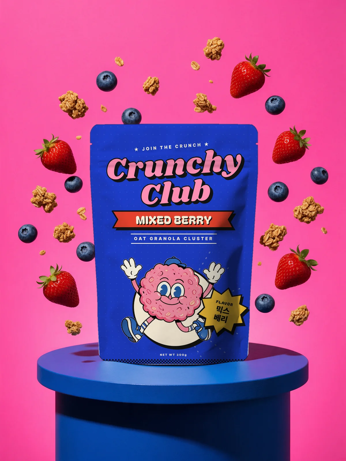 Mixed Berry pouch on a blue podium against a pink backdrop