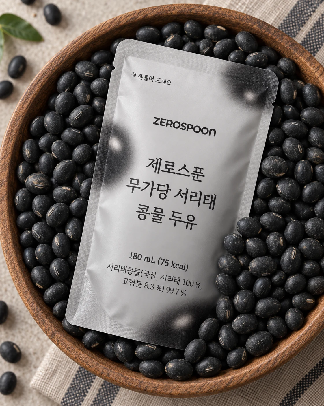 Pouch resting on black soybeans in a wooden tray