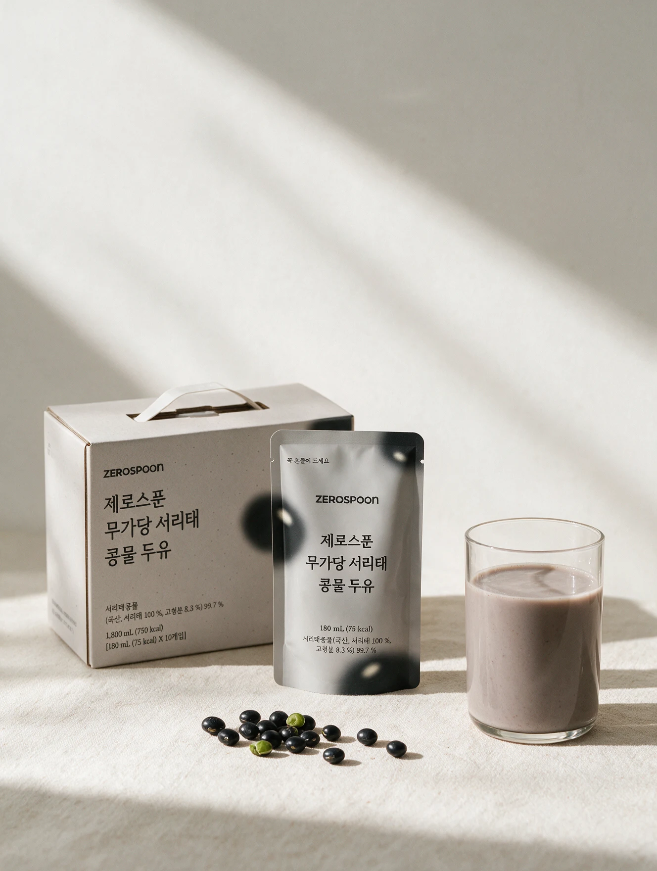 Soy milk box, pouch and glass in soft window light