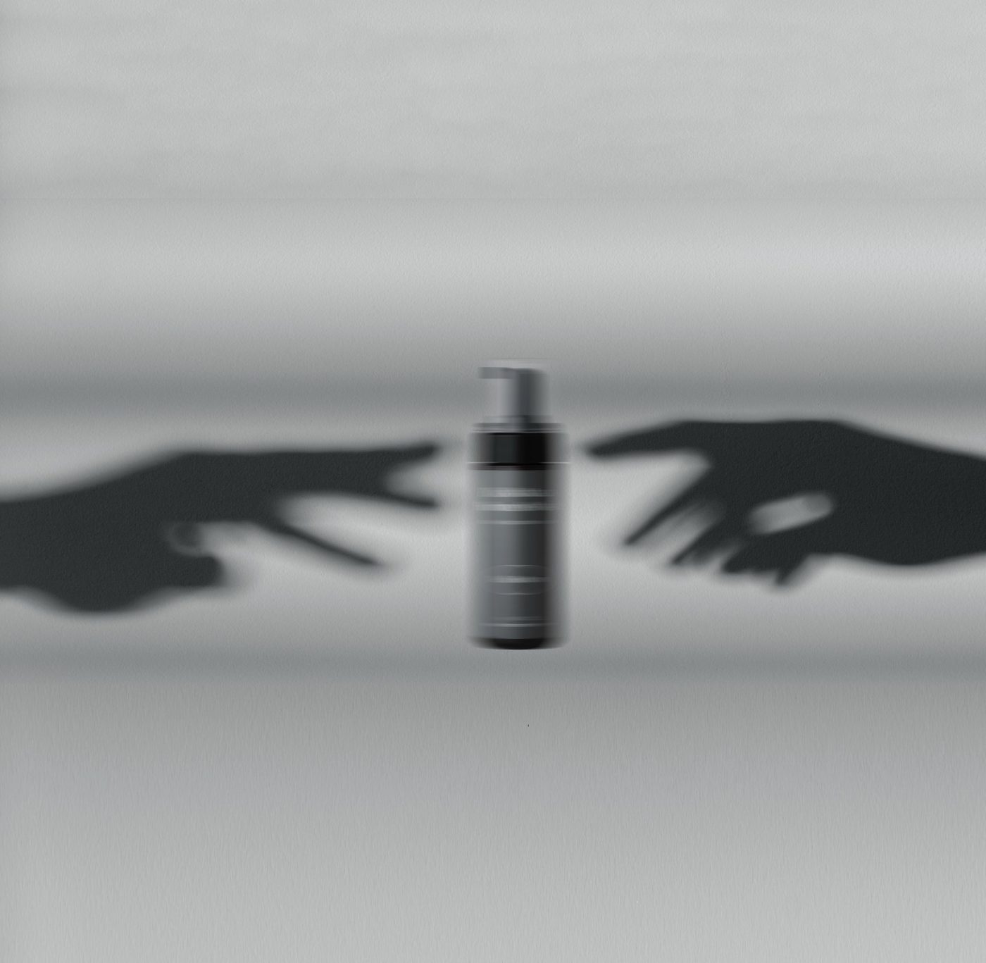 Bottle between two hand shadows